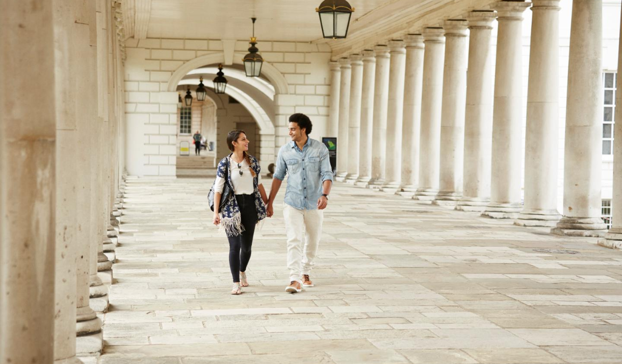 Unmissable - A couple walk through the colonnades at the Queen's House